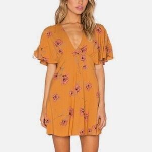 Free People Drapey Melanie Printed Mini Dress in mustard floral size 2 BOHO